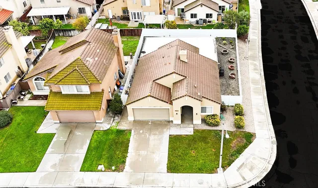 an aerial view of a house with swimming pool