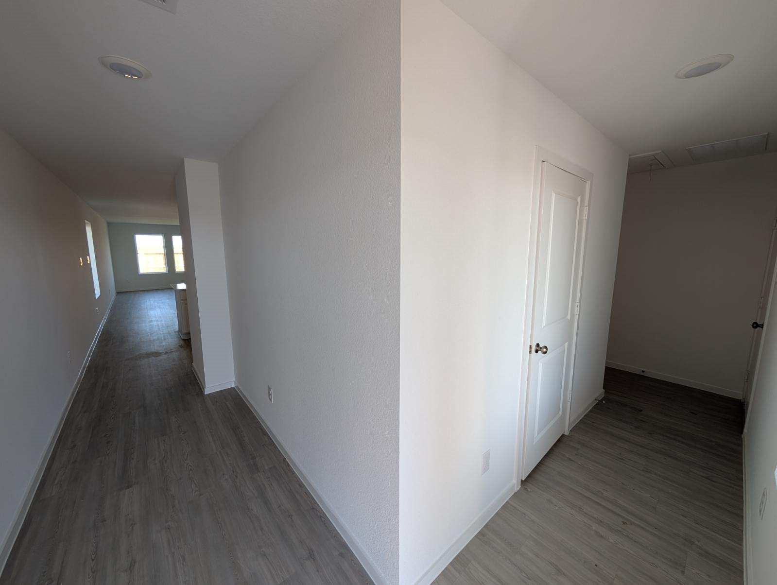 2927 Summer Breeze Way Angleton, TX 77515 - Photo 3 of 16 a view of a hallway with wooden floor