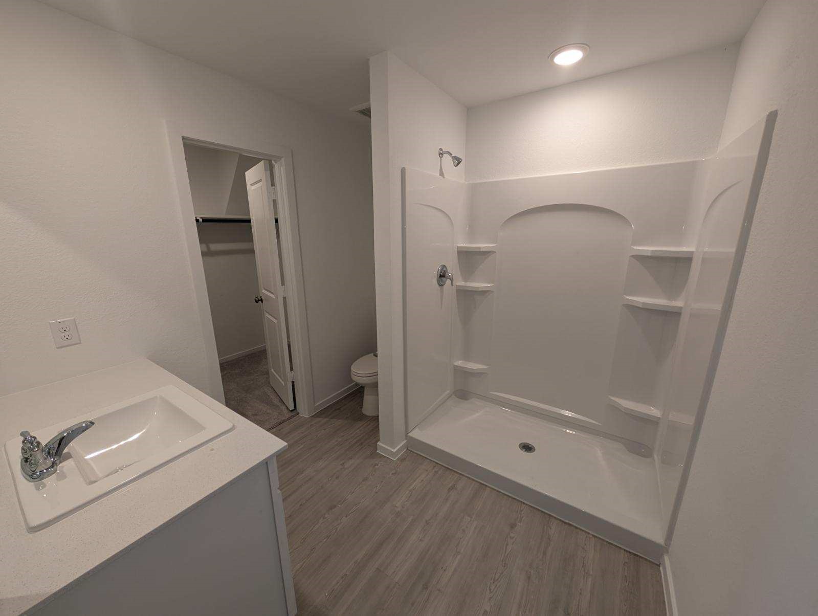 2927 Summer Breeze Way Angleton, TX 77515 - Photo 6 of 16 a bathroom with a shower and sink