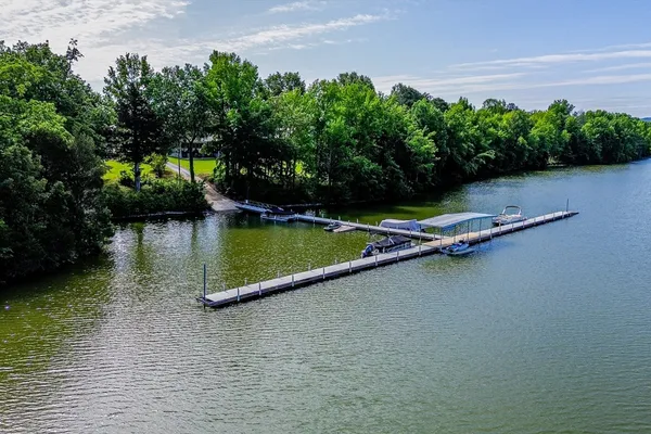 a view of a lake with boats in front of it