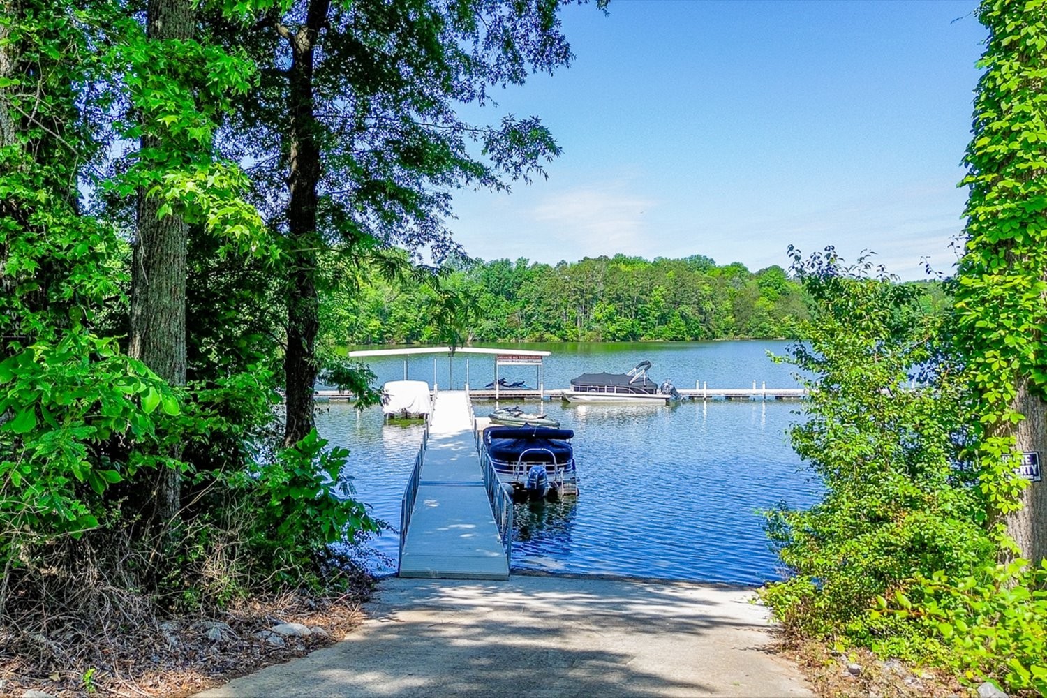6 Cypress Point Drive Winchester, TN 37398 - Photo 57 of 58 a view of a patio with table and chairs potted plants and large tree