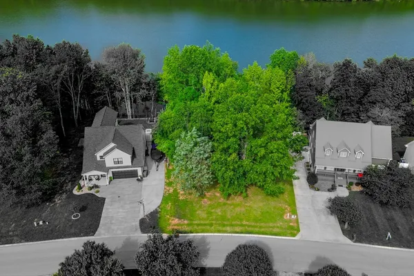 a view of a lake with a house in the background