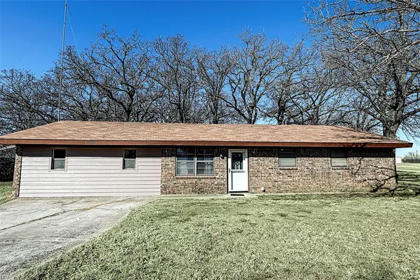 a front view of a house with parking
