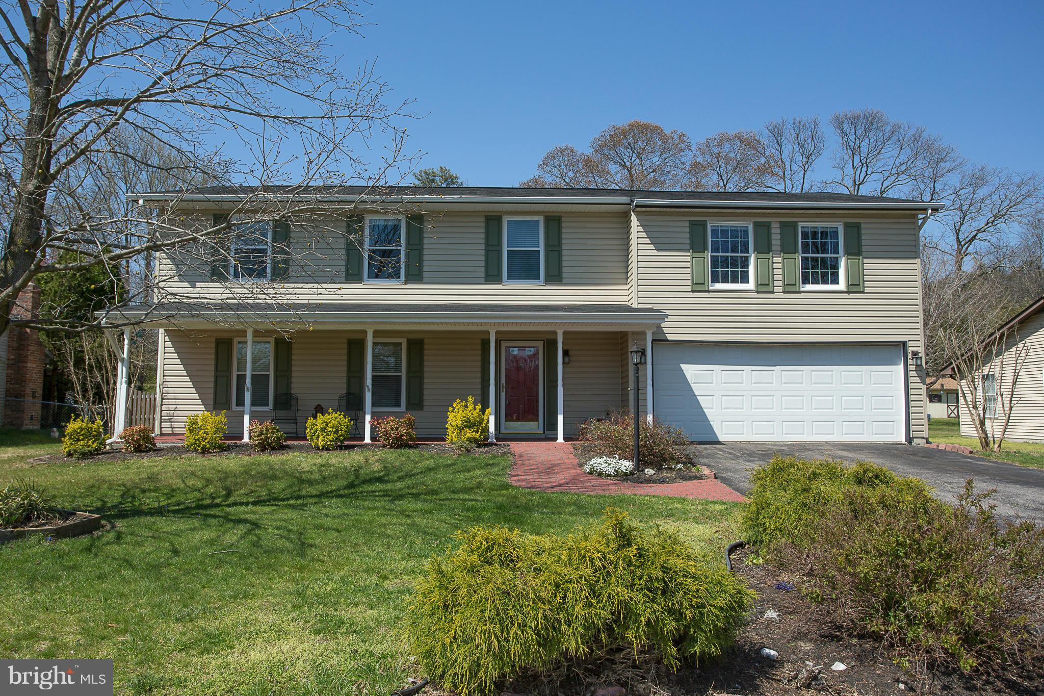 8208 Grassland Road Severn, MD 21144 - Photo 1 of 30 a front view of a house with a yard