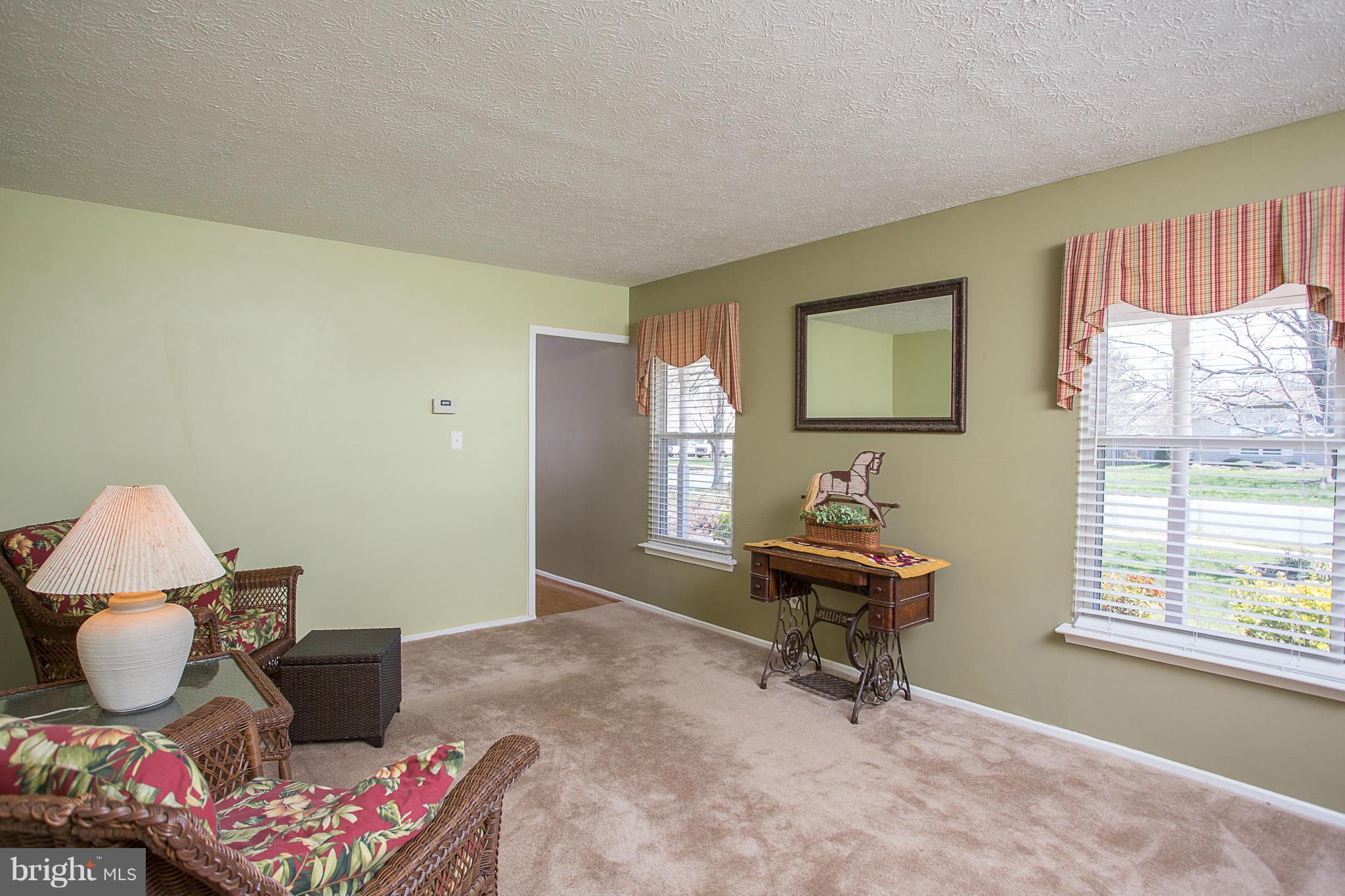 8208 Grassland Road Severn, MD 21144 - Photo 4 of 30 a living room with furniture and a window