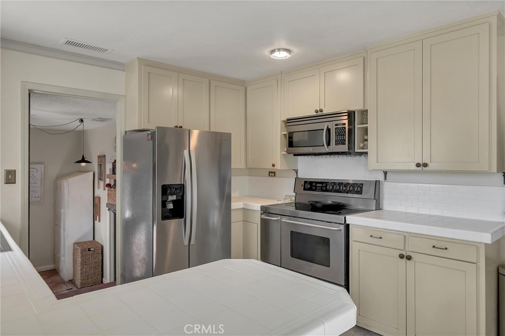 5805 Gradley Lane Paradise, CA 95969 - Photo 11 of 31 a kitchen with a refrigerator stove and microwave