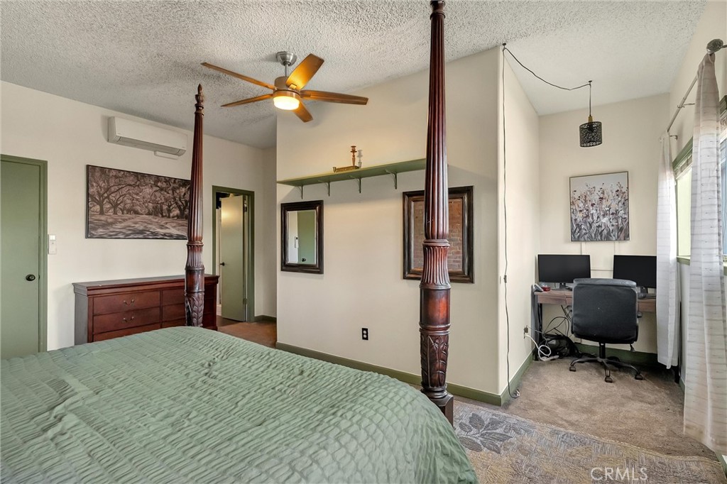 5805 Gradley Lane Paradise, CA 95969 - Photo 13 of 31 a bedroom with a bed and a chandelier