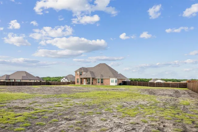 a view of a house with a big yard