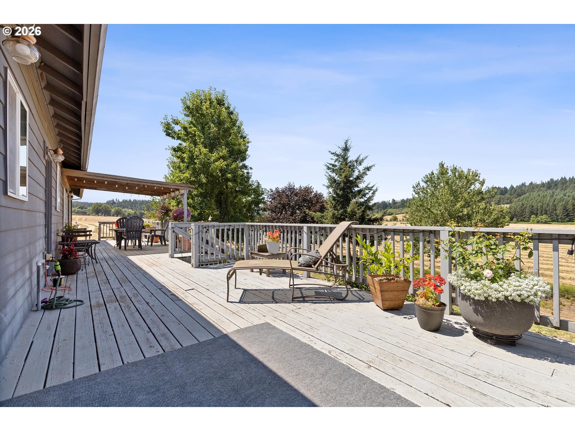 23455 Northeast Spring Hill Road Gaston, OR 97119 - Photo 38 of 48 a view of roof deck with wooden floor and seating space