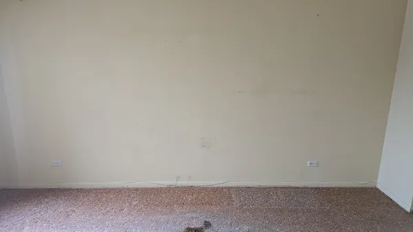 a kitchen with stainless steel appliances granite countertop a refrigerator and a stove