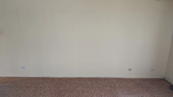 a view of a room that has a large window