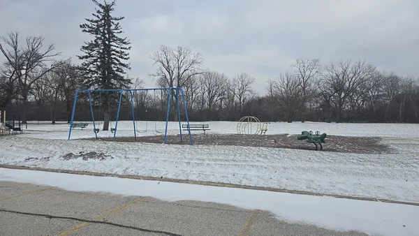 a view of a yard covered with snow