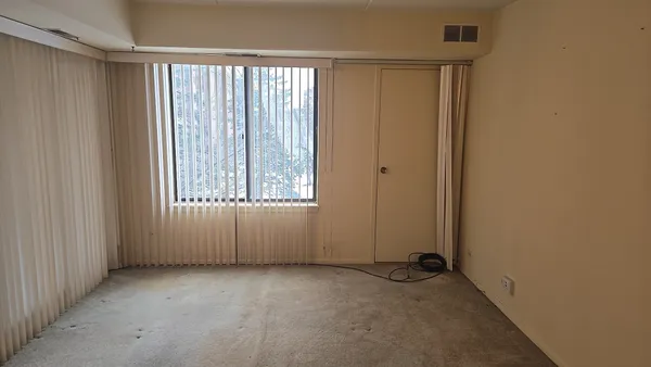 an empty room with windows