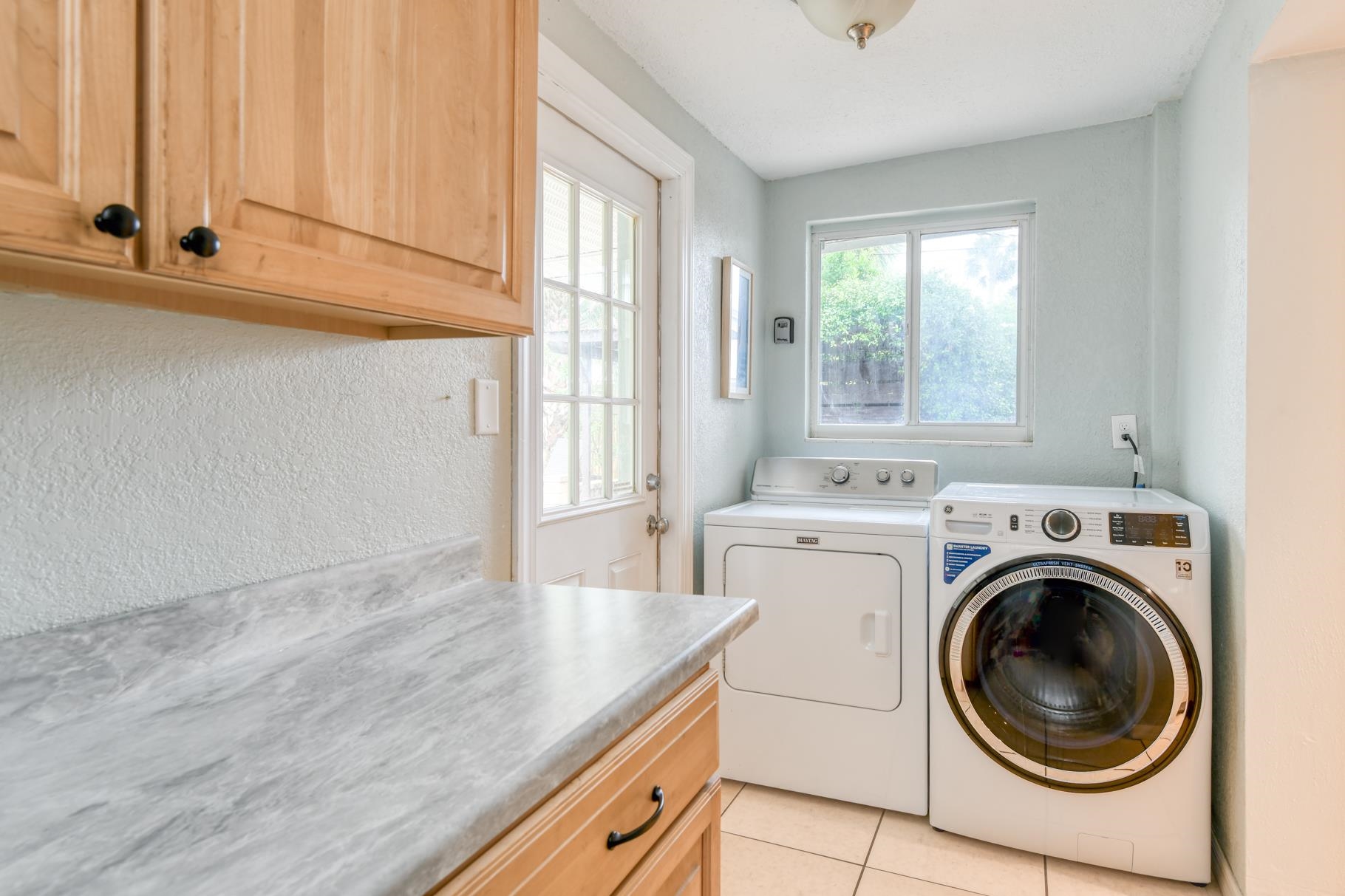 159 Southwind Circle St. Augustine, FL 32080 - Photo 19 of 36 a view of a kitchen with washer and dryer