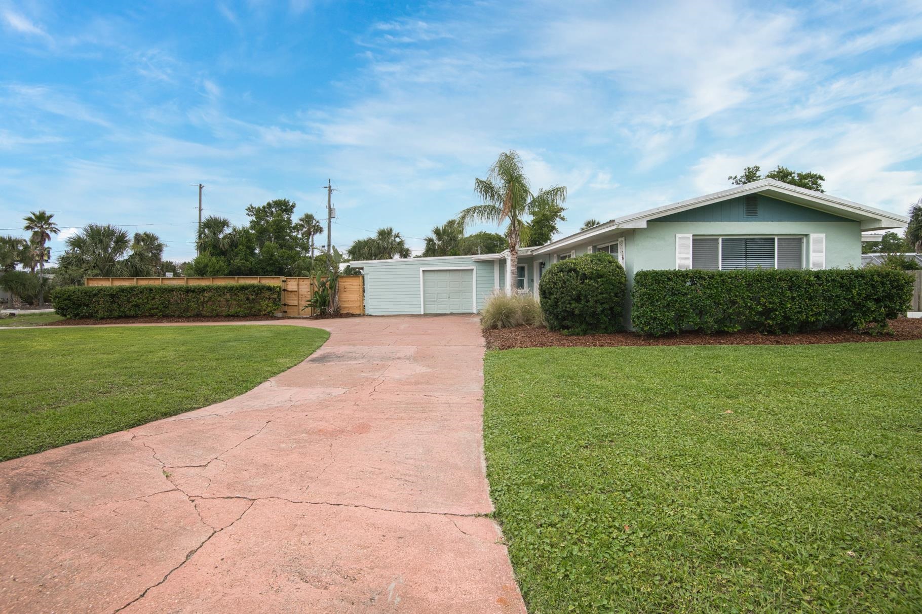 159 Southwind Circle St. Augustine, FL 32080 - Photo 35 of 36 a front view of a house with a yard and garage