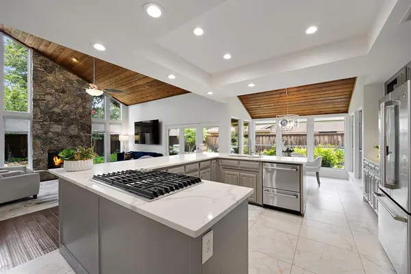 a kitchen with a stove and a refrigerator