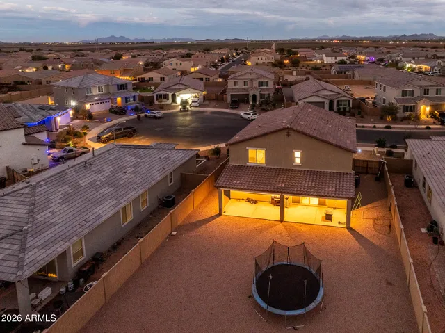 an aerial view of a house with a swimming pool