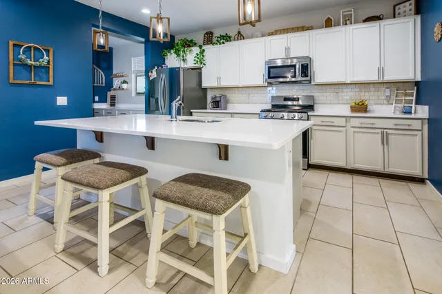 a kitchen with a sink cabinets and window