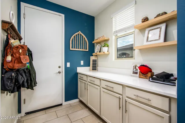 a kitchen with a sink and cabinets