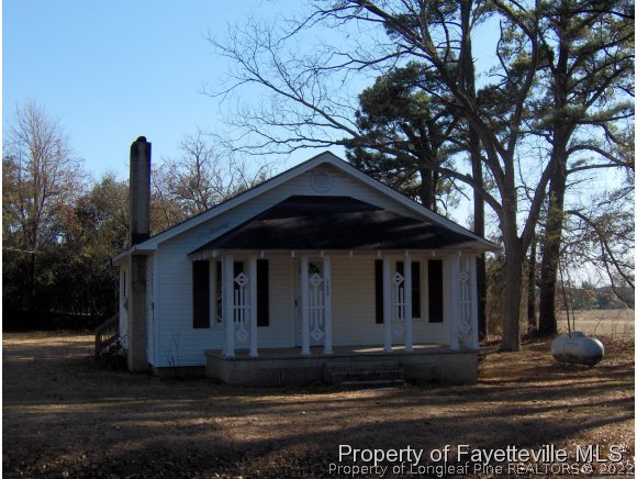 125 Reservation Road Aberdeen, NC 28315 - Photo 1 of 7 a front view of a house with garden