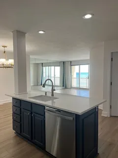 a kitchen with a sink and cabinets