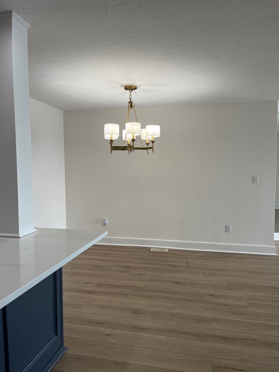 66 Glades Road, Unit 5 Scituate, MA 02066 - Photo 4 of 14 a view of a room with wooden floor