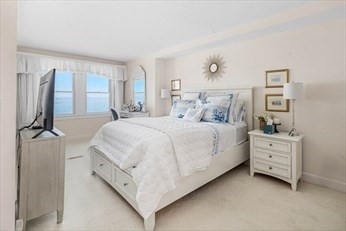 66 Glades Road, Unit 5 Scituate, MA 02066 - Photo 6 of 11 a bed room with a bed and a window