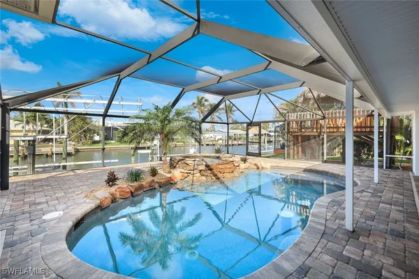 a view of a swimming pool with a patio