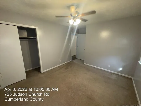 an empty room with a bathroom