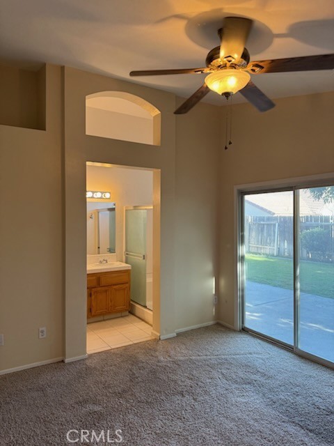 8707 Winlock Street Bakersfield, CA 93312 - Photo 13 of 18 a view of an empty room and a bathroom