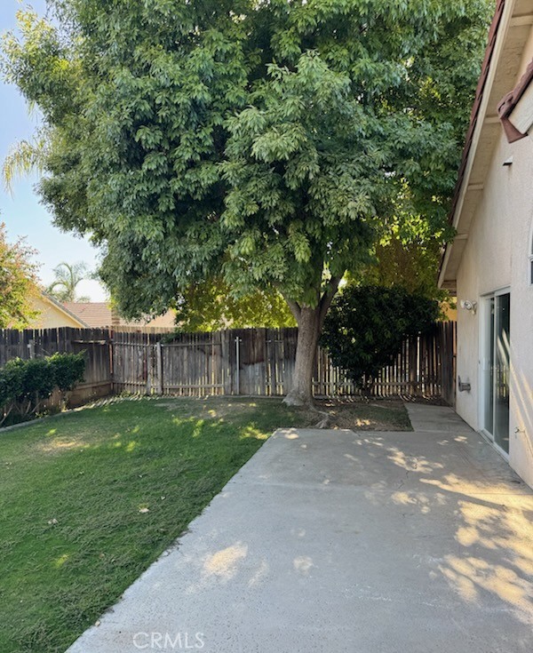 8707 Winlock Street Bakersfield, CA 93312 - Photo 16 of 18 a view of a back yard