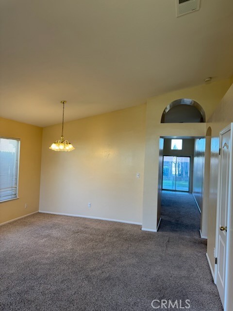 8707 Winlock Street Bakersfield, CA 93312 - Photo 2 of 18 a view of a livingroom with a chandelier