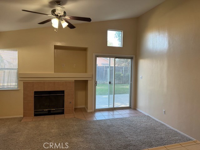 8707 Winlock Street Bakersfield, CA 93312 - Photo 5 of 18 a view of an empty room with a fireplace and a window