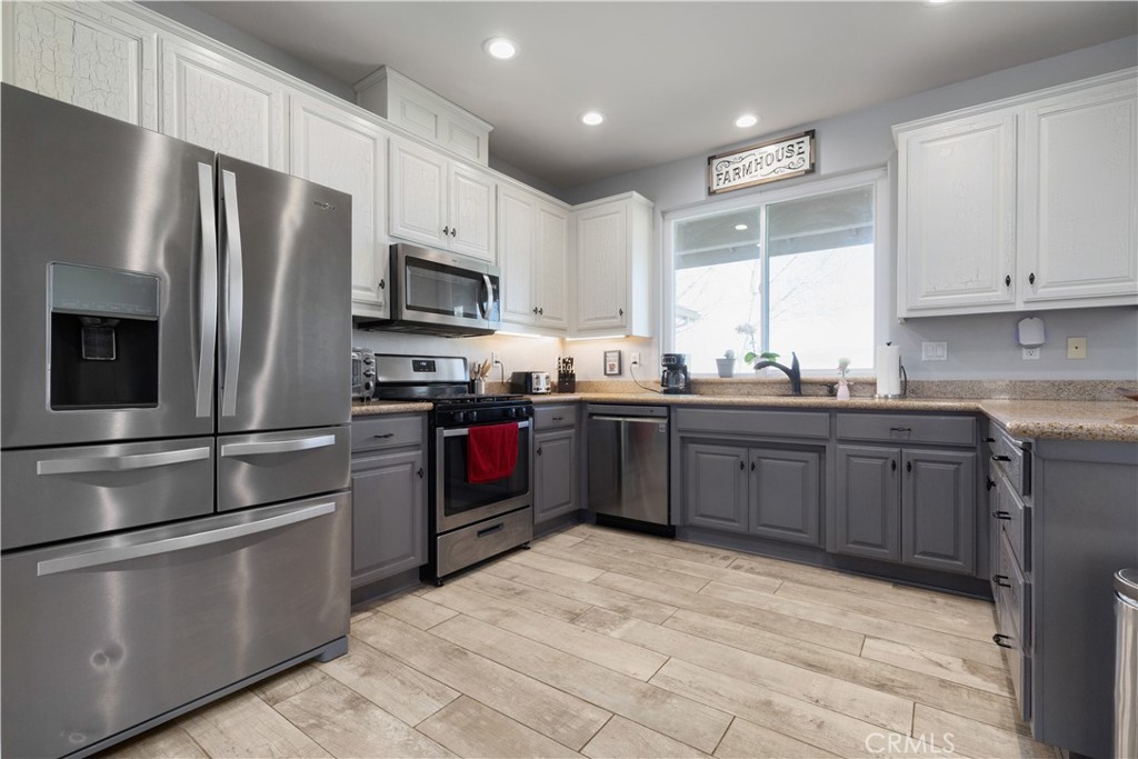 76870 Barker Road San Miguel, CA 93451 - Photo 13 of 66 a kitchen with stainless steel appliances granite countertop a stove a sink dishwasher a refrigerator and a microwave