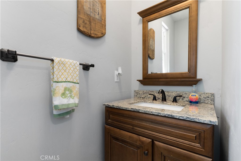 76870 Barker Road San Miguel, CA 93451 - Photo 21 of 66 a bathroom with a sink and a mirror