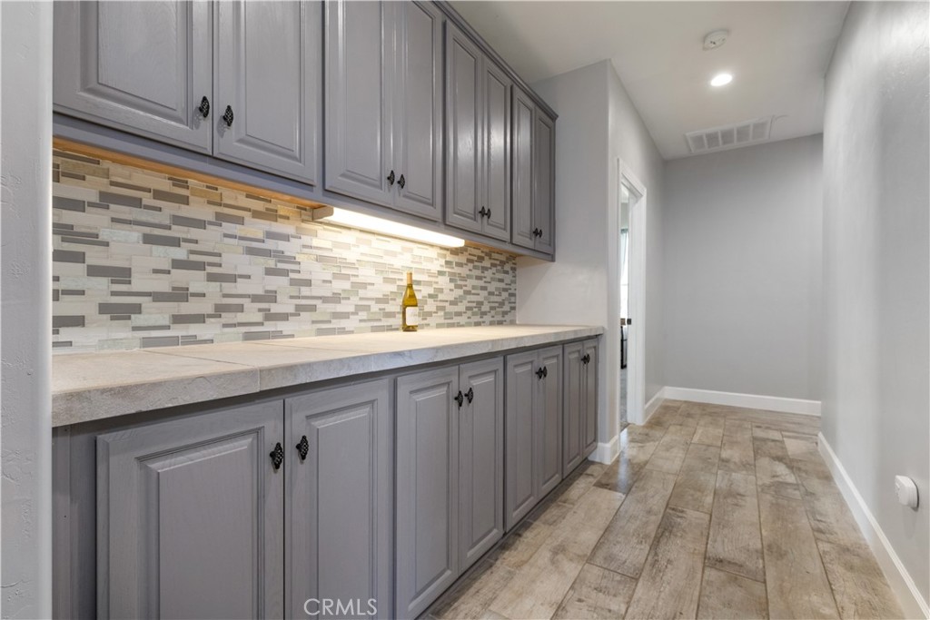 76870 Barker Road San Miguel, CA 93451 - Photo 22 of 66 a kitchen with granite countertop white cabinets and sink