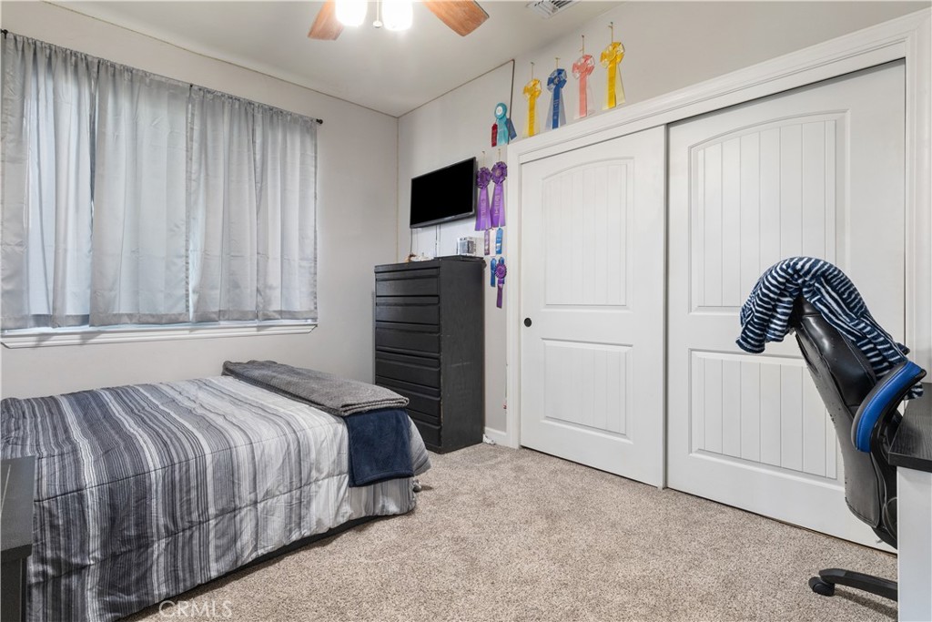 76870 Barker Road San Miguel, CA 93451 - Photo 23 of 66 a bedroom with a bed and a book shelf