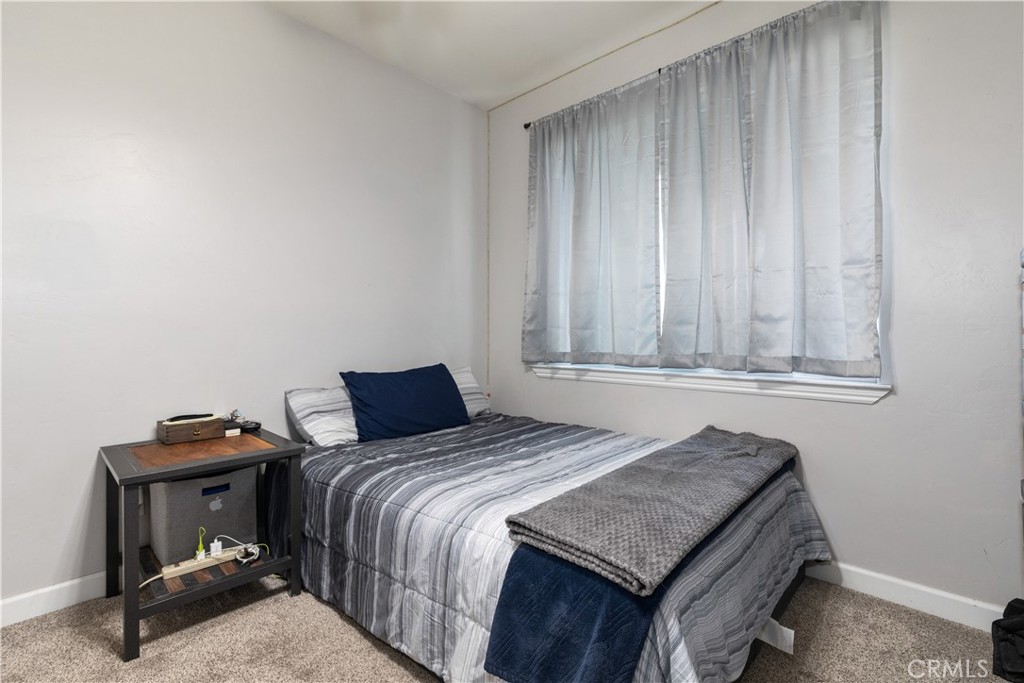 76870 Barker Road San Miguel, CA 93451 - Photo 24 of 66 a bedroom with a bed and a chair