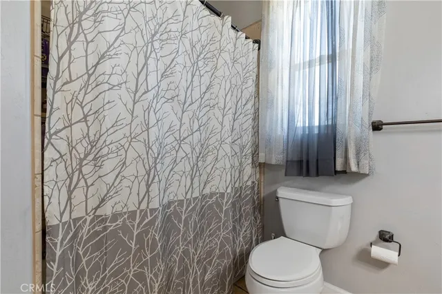 a bedroom with furniture and a wooden floor