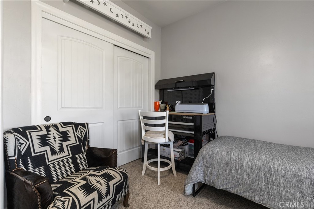 76870 Barker Road San Miguel, CA 93451 - Photo 31 of 66 a bedroom with furniture and a wooden floor