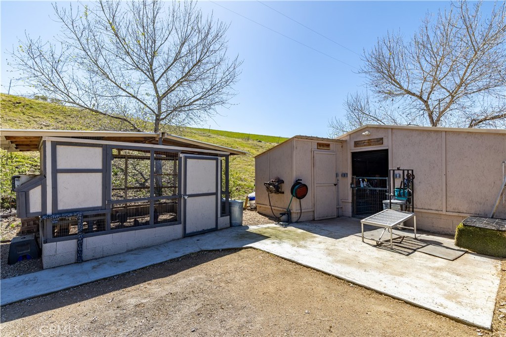 76870 Barker Road San Miguel, CA 93451 - Photo 51 of 66 a view of a house with a barbeque and wooden fence