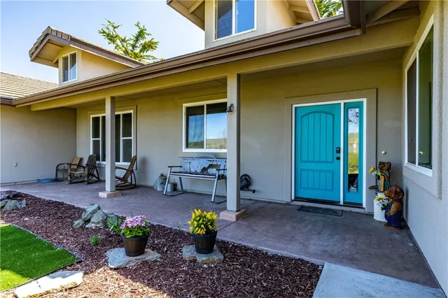 a view of a house with outdoor seating