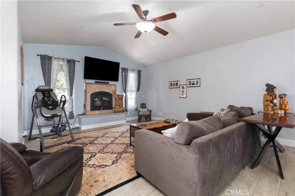 76870 Barker Road San Miguel, CA 93451 - Photo 10 of 66 a living room with furniture a flat screen tv and a fireplace