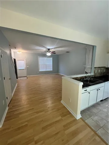 a kitchen with a sink and cabinets