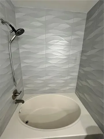 a bathroom with a bath tub