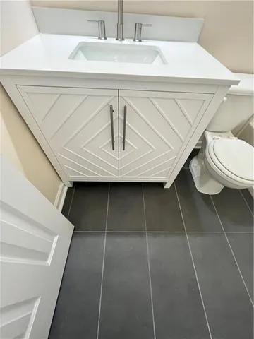 a bathroom with a toilet and a sink