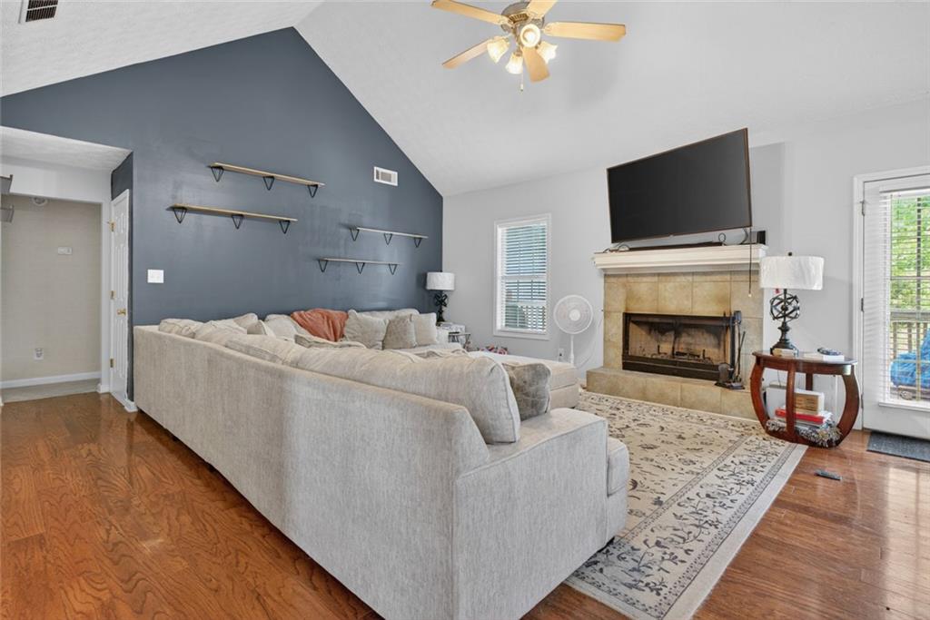 120 Norman Road Covington, GA 30014 - Photo 11 of 31 a living room with furniture fireplace and flat screen tv