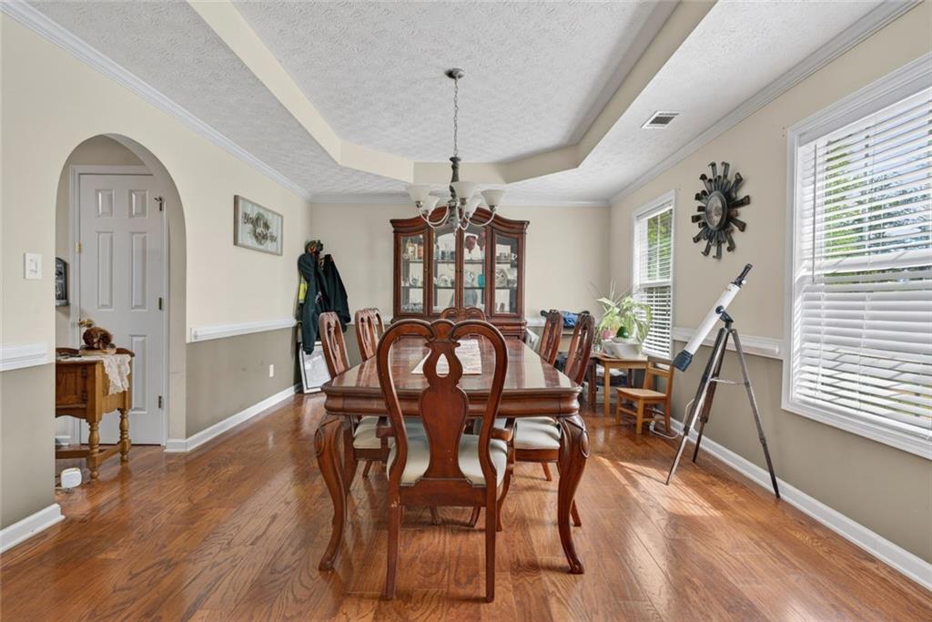 120 Norman Road Covington, GA 30014 - Photo 12 of 31 a view of a dining room with furniture window and wooden floor