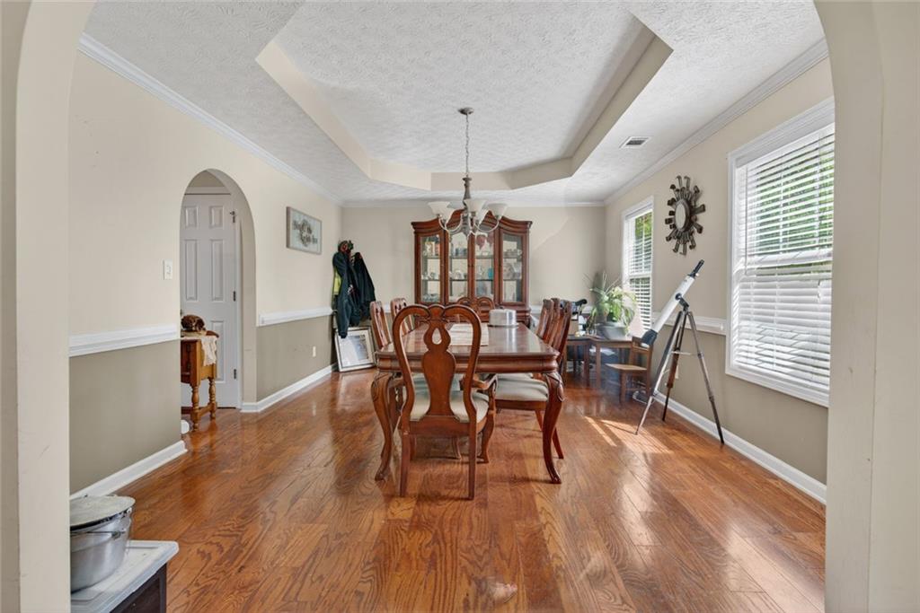 120 Norman Road Covington, GA 30014 - Photo 13 of 31 a view of a dining room with furniture and wooden floor