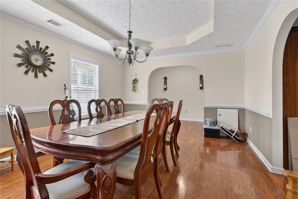 120 Norman Road Covington, GA 30014 - Photo 14 of 31 a view of a a dining room with furniture window and wooden floor